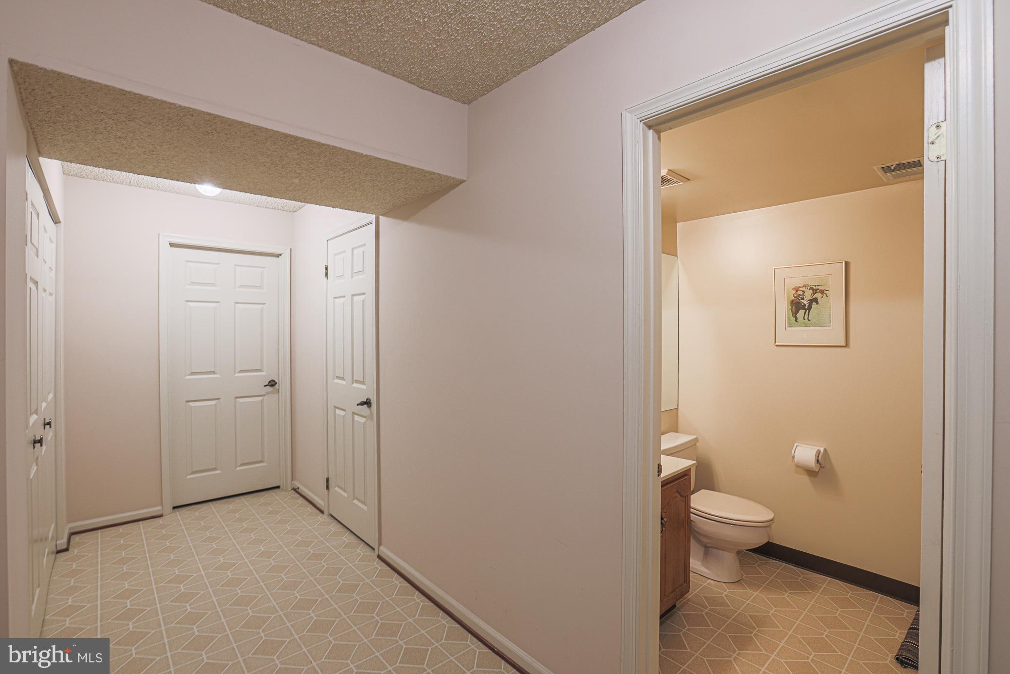 260 Hunters Ridge Road Lutherville-Timonium, MD 21093 - Photo 38 of 48 a bathroom with a granite countertop toilet and a sink