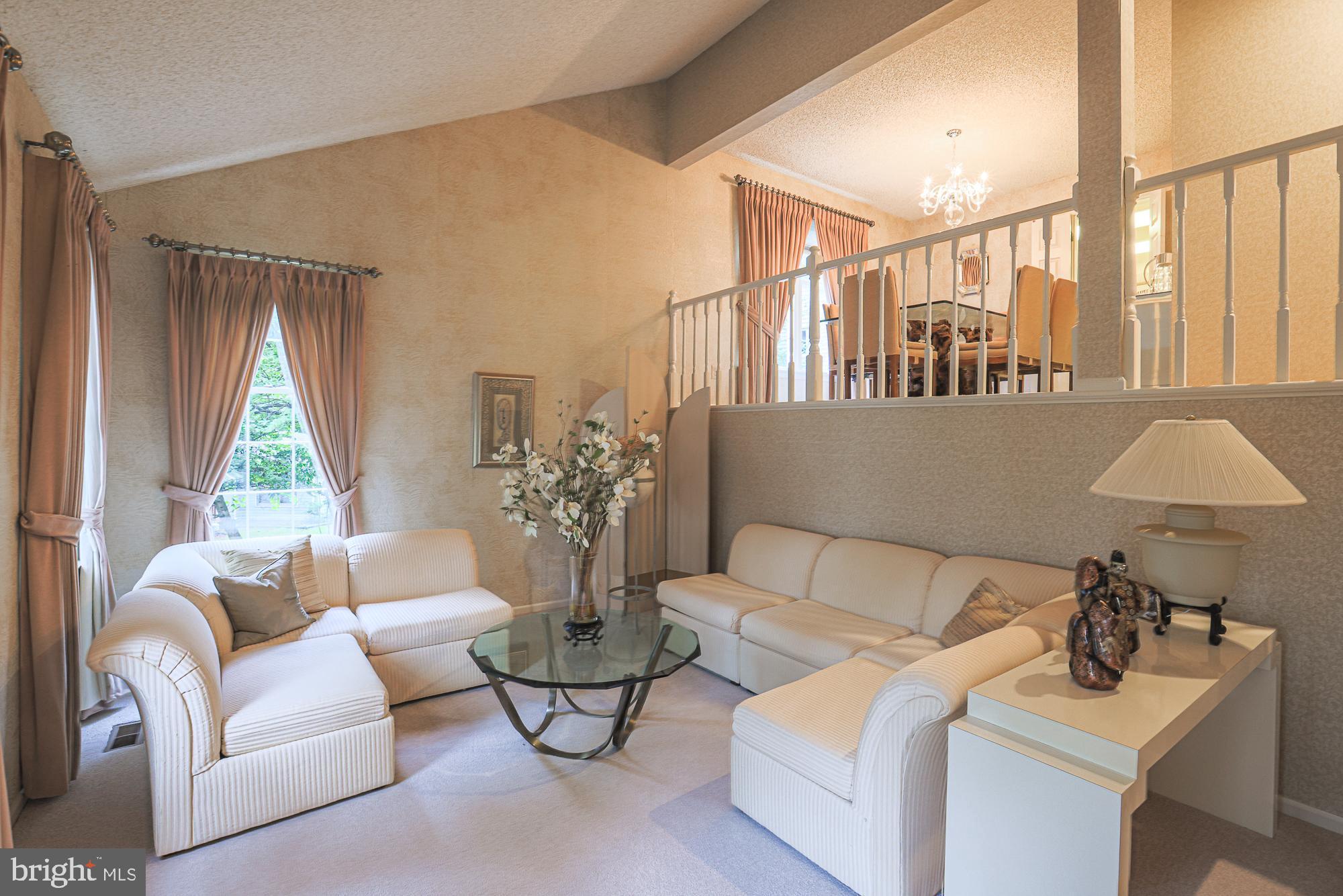 260 Hunters Ridge Road Lutherville-Timonium, MD 21093 - Photo 7 of 48 a living room with furniture and a large window