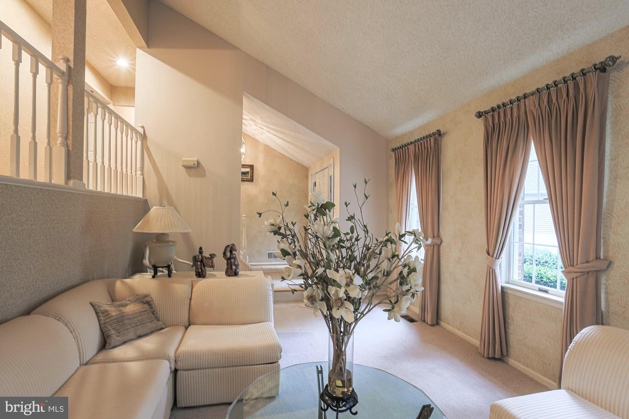 260 Hunters Ridge Road Lutherville-Timonium, MD 21093 - Photo 8 of 48 a living room with furniture and a large window