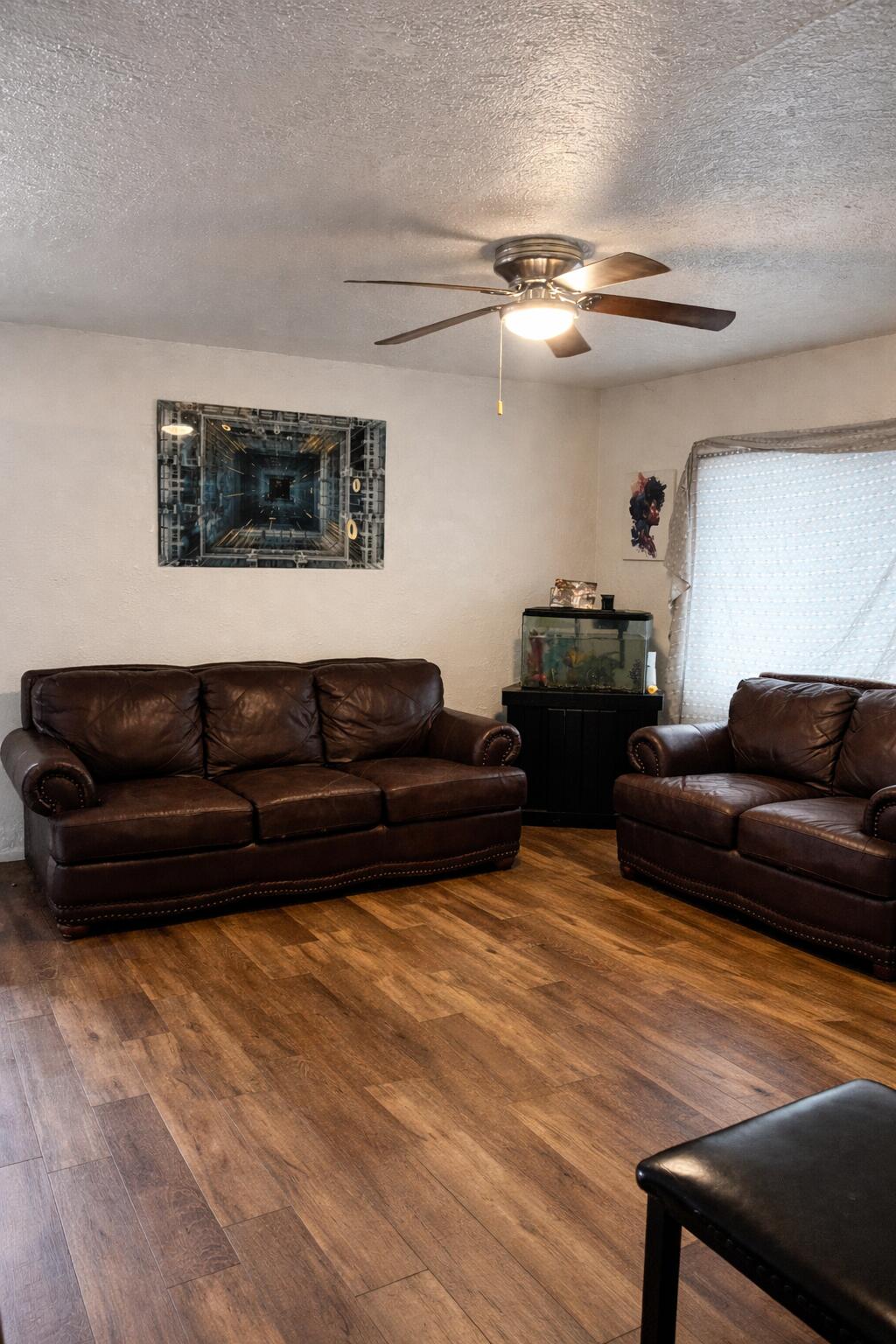 5617 East 13th Place Gary, IN 46403 - Photo 8 of 12 a living room with furniture and a ceiling fan