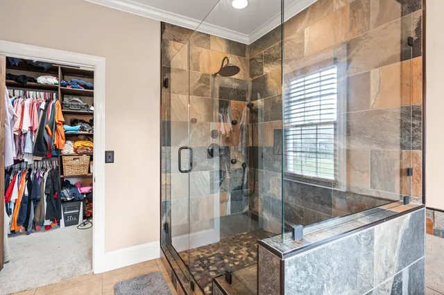a view of a hallway with wooden floor and stairs