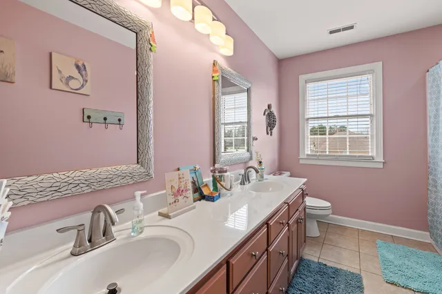 a bedroom with furniture and a chandelier