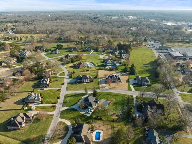 an aerial view of residential building and parking space