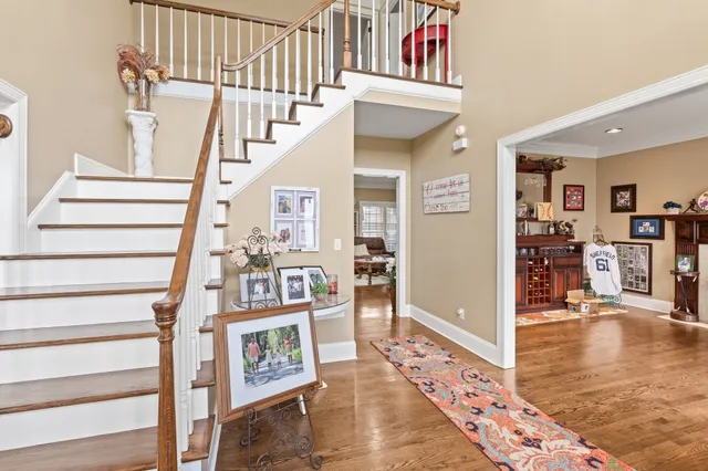 a view of an entryway with wooden floor and windows