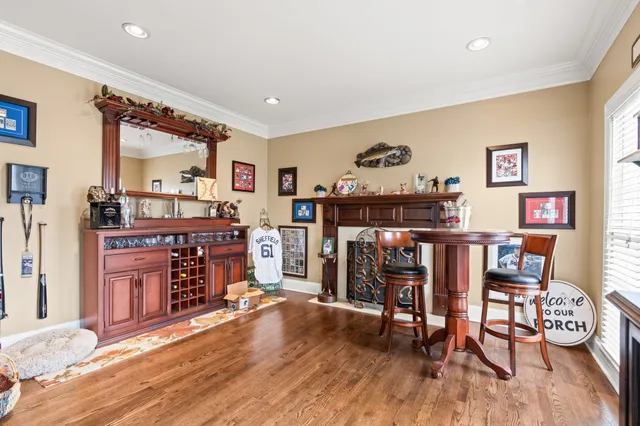 a view of a dining room with furniture and wooden floor