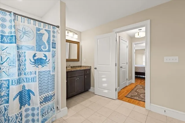 a room with a bed and a view of bathroom