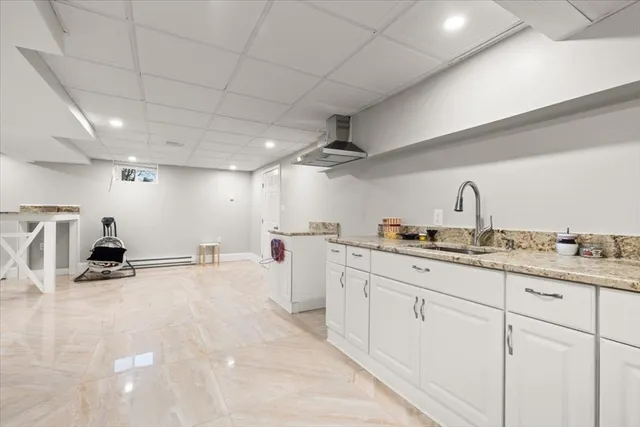 a kitchen with sink and cabinets