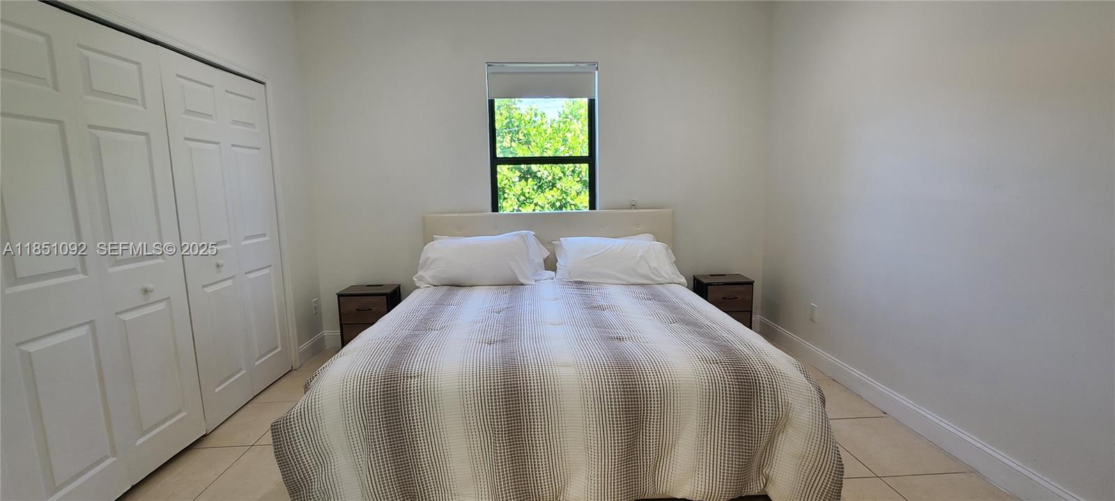 1721 Southwest 24th Terrace Miami, FL 33145 - Photo 32 of 80 a bedroom with a bed and window