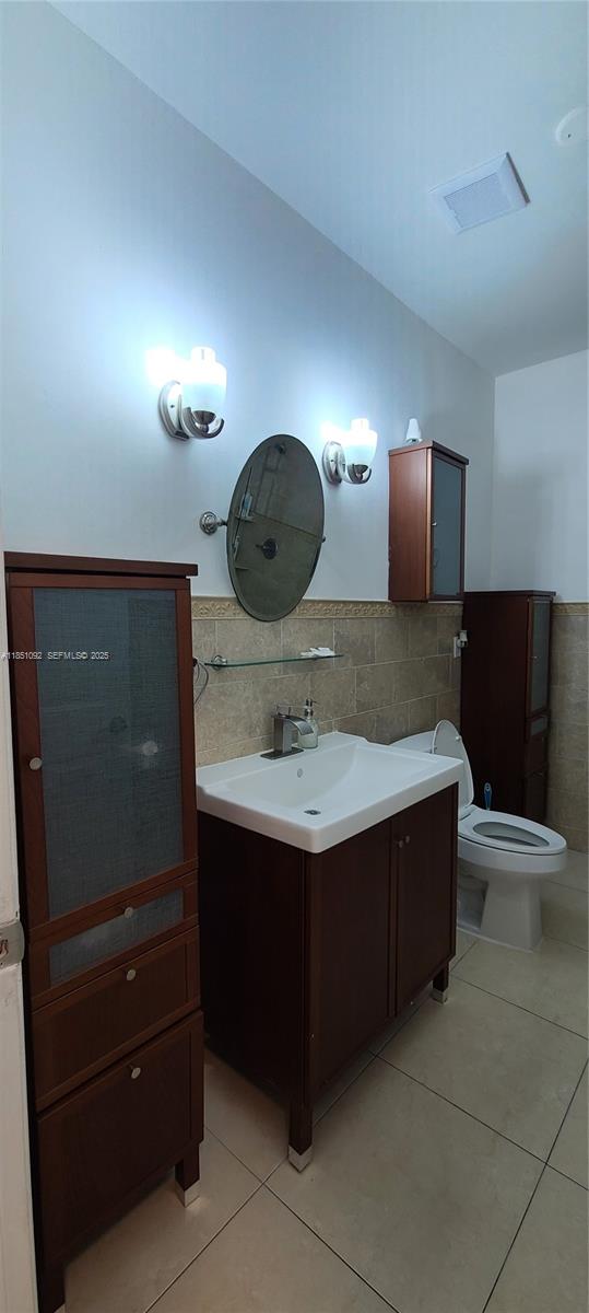 1721 Southwest 24th Terrace Miami, FL 33145 - Photo 35 of 80 a bathroom with a sink and a mirror