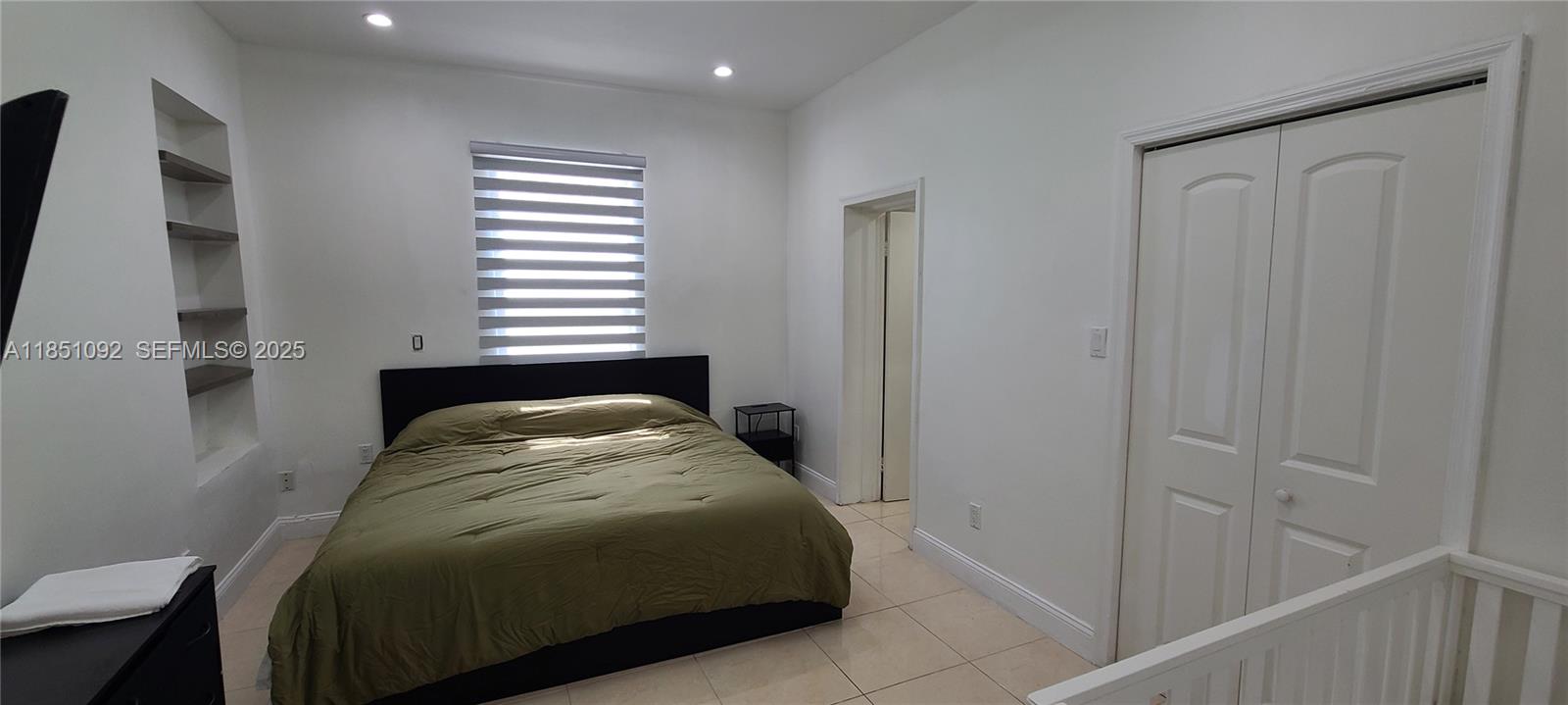 1721 Southwest 24th Terrace Miami, FL 33145 - Photo 41 of 80 a bedroom with a bed and a window