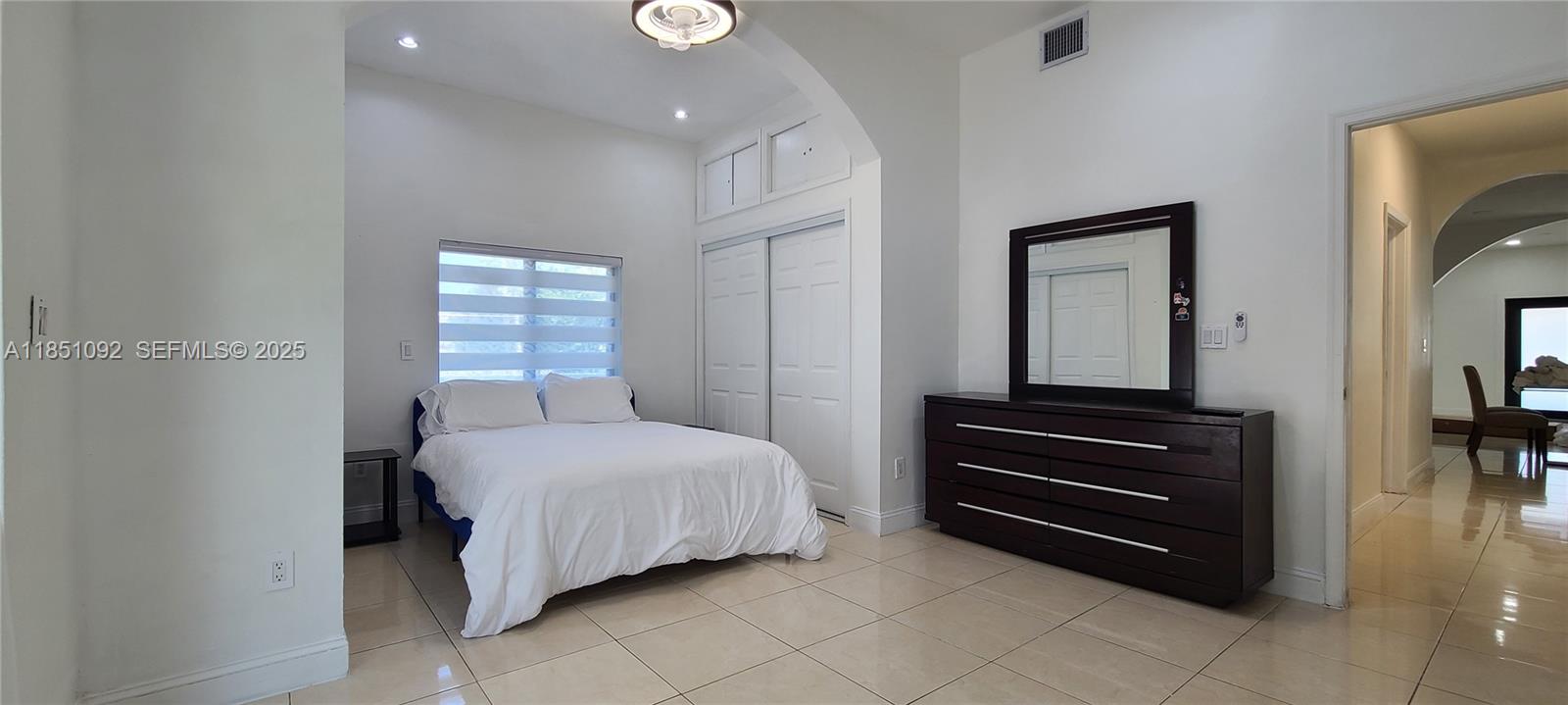 1721 Southwest 24th Terrace Miami, FL 33145 - Photo 49 of 80 a bedroom with a bed and a mirror