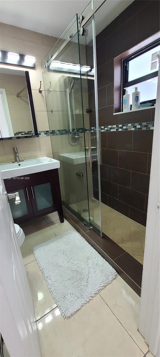 1721 Southwest 24th Terrace Miami, FL 33145 - Photo 51 of 80 a bathroom with a sink and mirror