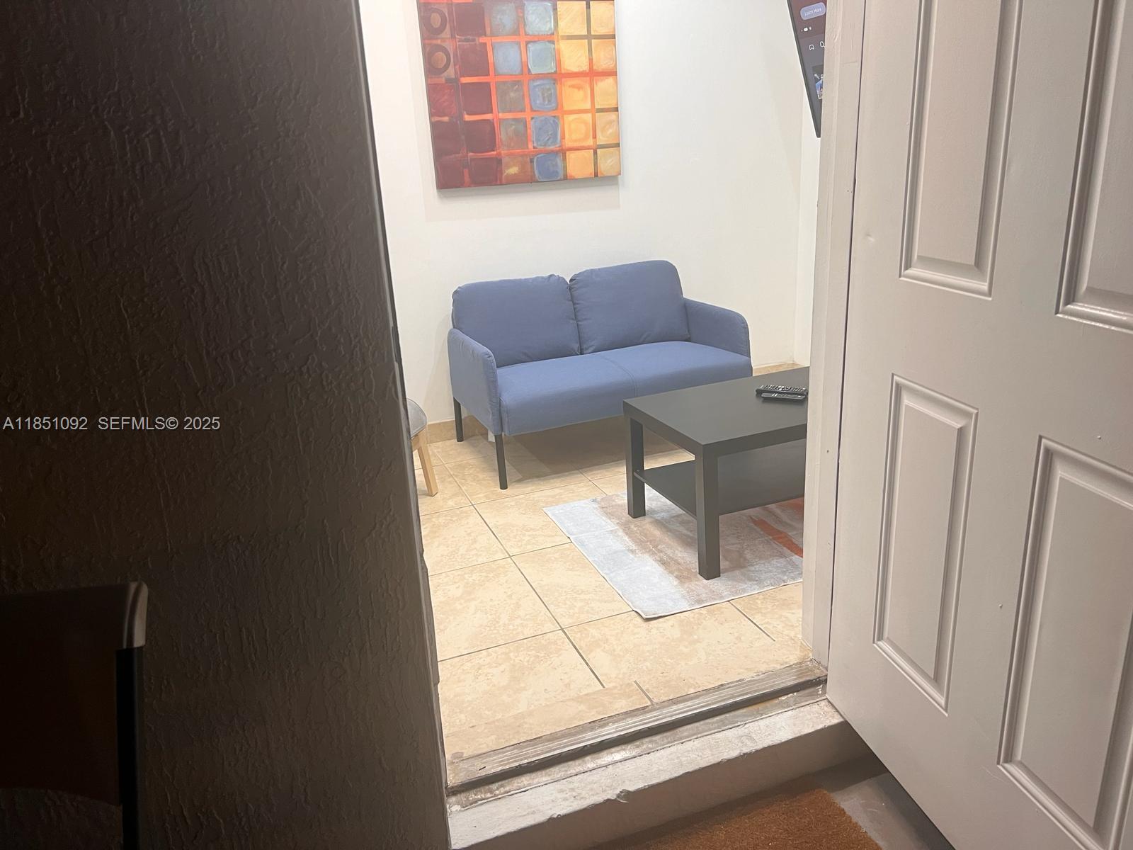 1721 Southwest 24th Terrace Miami, FL 33145 - Photo 60 of 80 a living room with furniture and a gate