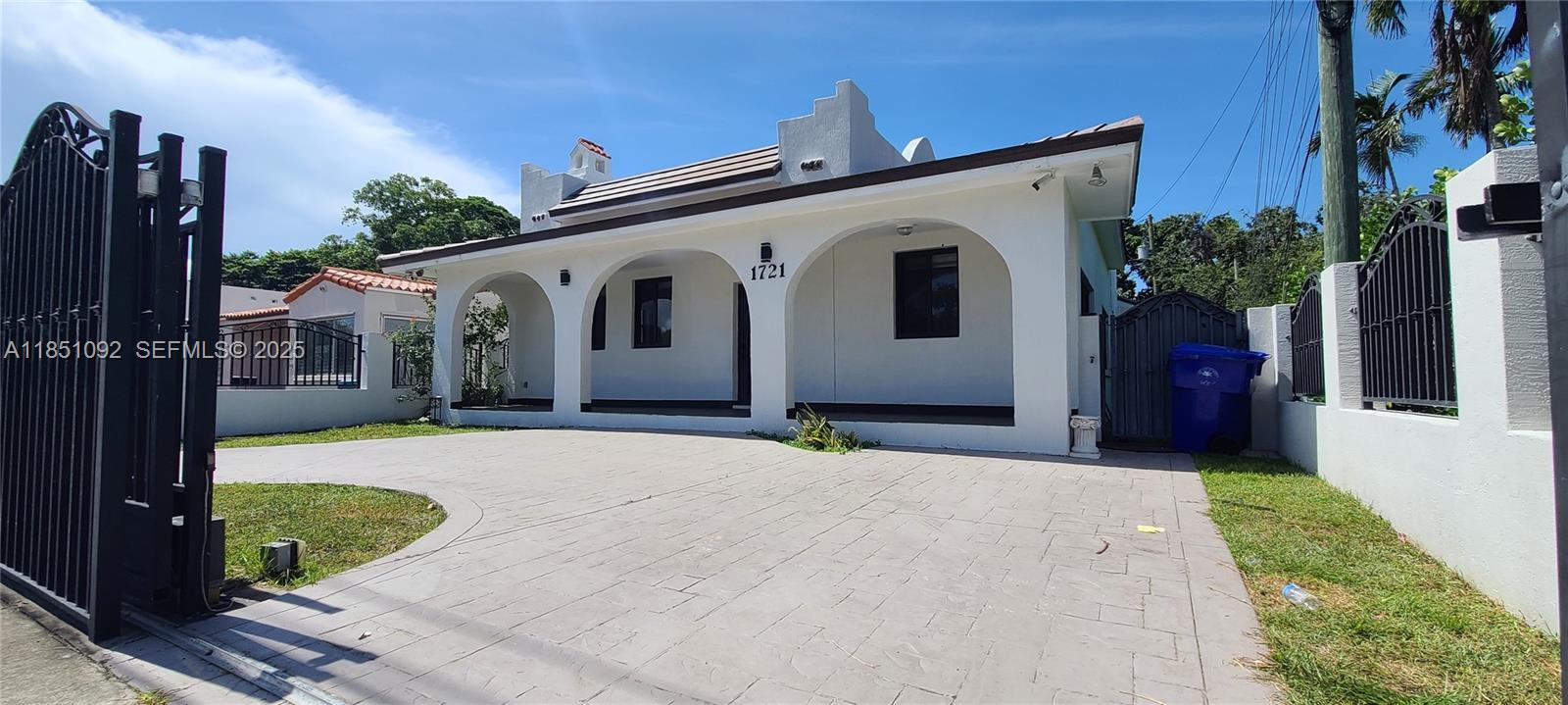 1721 Southwest 24th Terrace Miami, FL 33145 - Photo 77 of 80 a front view of a house with a yard