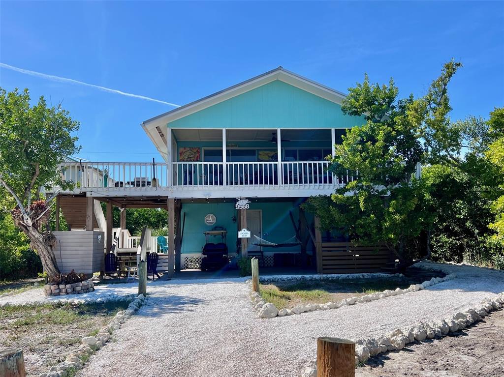 9568 Buccaneer Trail Boca Grande, FL 33921 - Photo 1 of 49 a view of a house with yard and sitting area