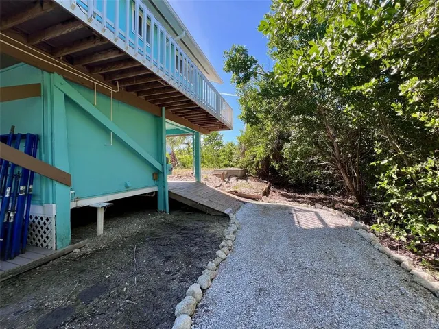 a view of a backyard with wooden floor and roof
