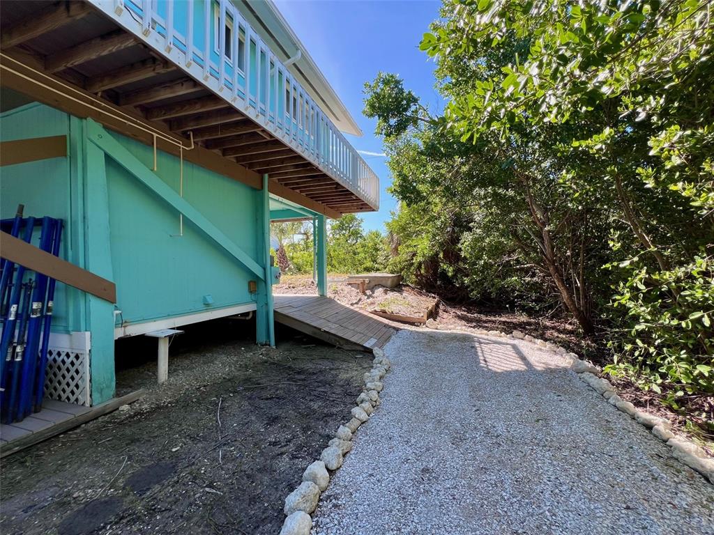 9568 Buccaneer Trail Boca Grande, FL 33921 - Photo 14 of 49 a view of a backyard with pathway