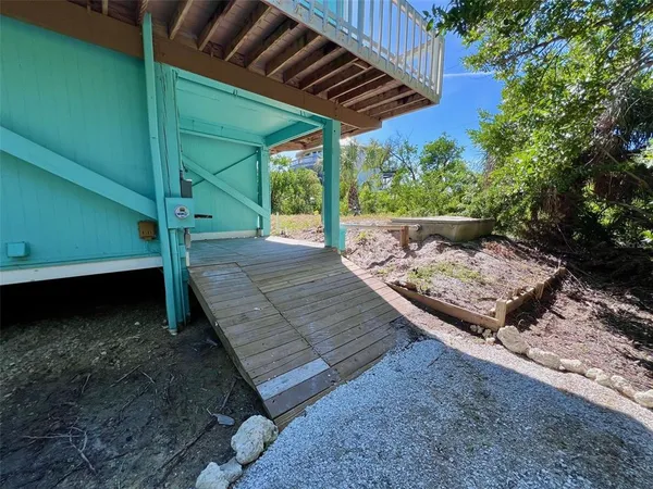 a view of a livingroom with furniture and hardwood floor