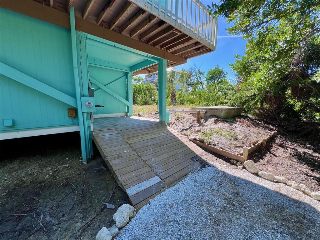 9568 Buccaneer Trail Boca Grande, FL 33921 - Photo 15 of 49 a view of a backyard with wooden floor and roof