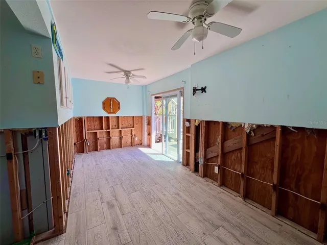 a view of a chairs and table in balcony