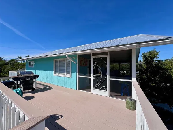 a view of a chairs and table in the patio