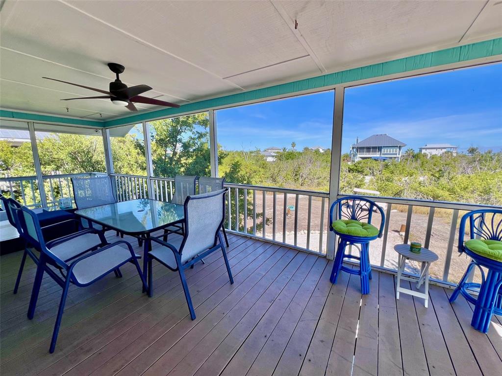 9568 Buccaneer Trail Boca Grande, FL 33921 - Photo 23 of 49 a view of a chairs and table in the patio