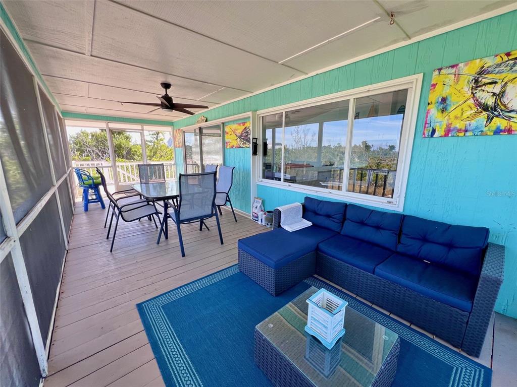 9568 Buccaneer Trail Boca Grande, FL 33921 - Photo 24 of 49 a living room with furniture and a large window