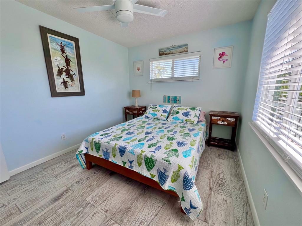 9568 Buccaneer Trail Boca Grande, FL 33921 - Photo 36 of 49 a bedroom with a bed and a window