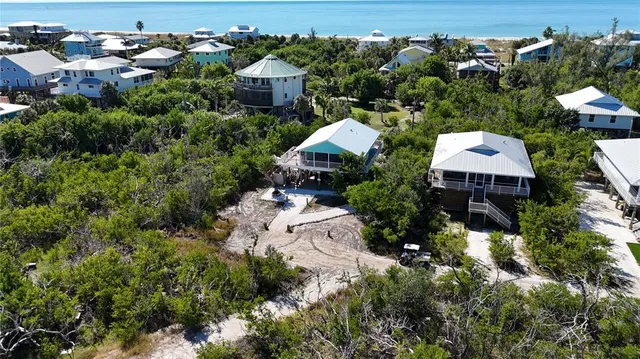 an aerial view of a house with outdoor space