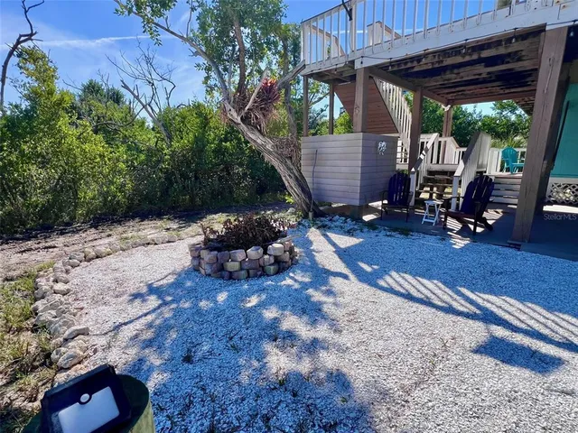 a view of a chairs and tables in the patio