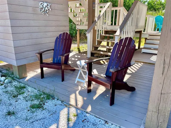 a view of balcony with wooden floor