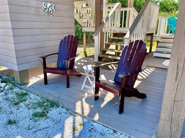 a view of balcony with wooden floor
