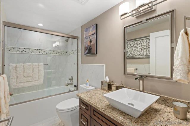 a view of a swimming pool and outdoor seating