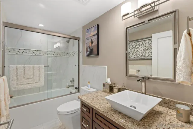 a view of a swimming pool and outdoor seating