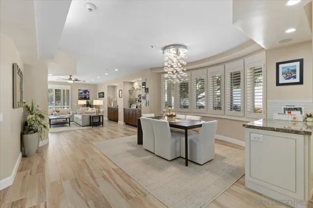 a kitchen with stainless steel appliances granite countertop a sink and a stove