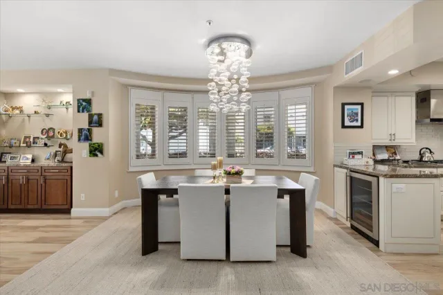 a kitchen with granite countertop a refrigerator stove and sink