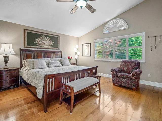 a bathroom with granite countertop double vanity and a bathtub