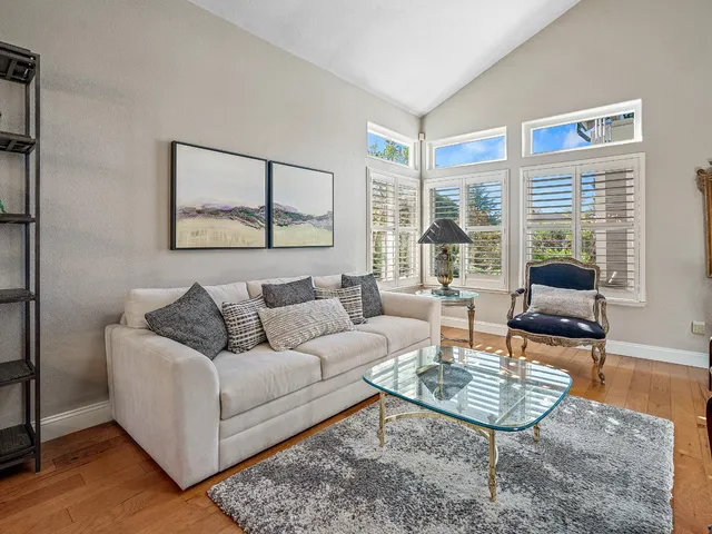 a living room with fireplace furniture and a window