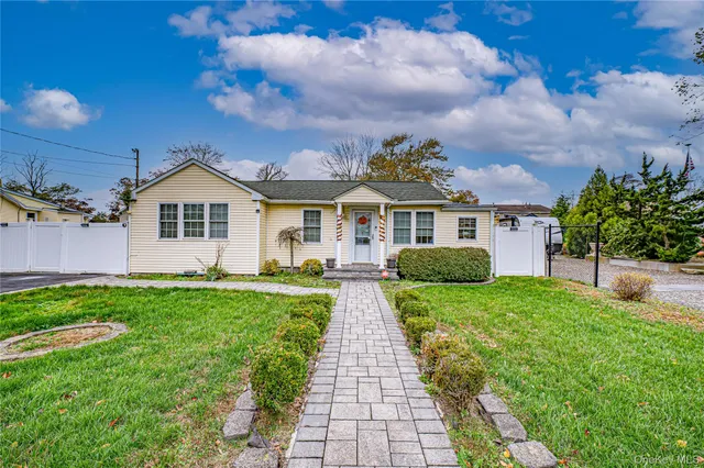 front view of a house with a yard