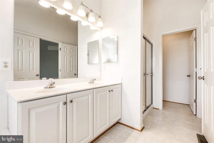 11843 Skylark Road Clarksburg, MD 20871 - Photo 17 of 31 a bathroom with a sink and a mirror