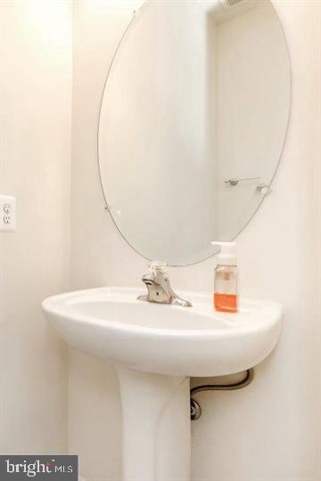 11843 Skylark Road Clarksburg, MD 20871 - Photo 29 of 31 a bathroom with a sink and a mirror