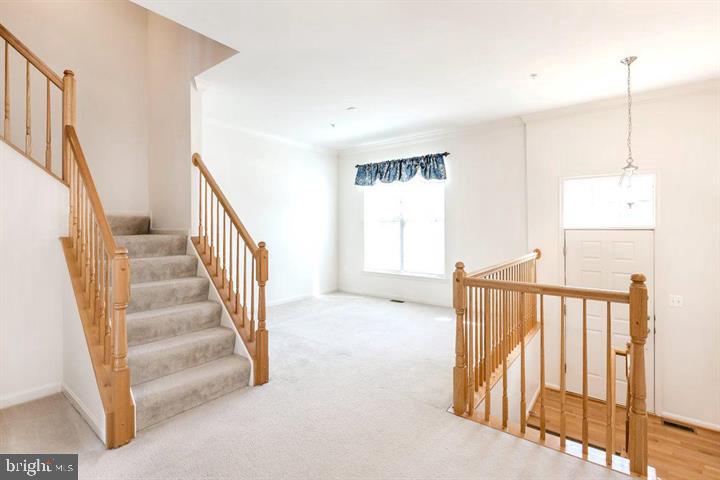 11843 Skylark Road Clarksburg, MD 20871 - Photo 5 of 31 a view of a hallway with windows and stairs