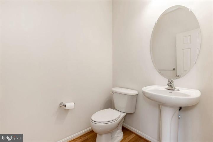 11843 Skylark Road Clarksburg, MD 20871 - Photo 7 of 31 a bathroom with a toilet sink and mirror
