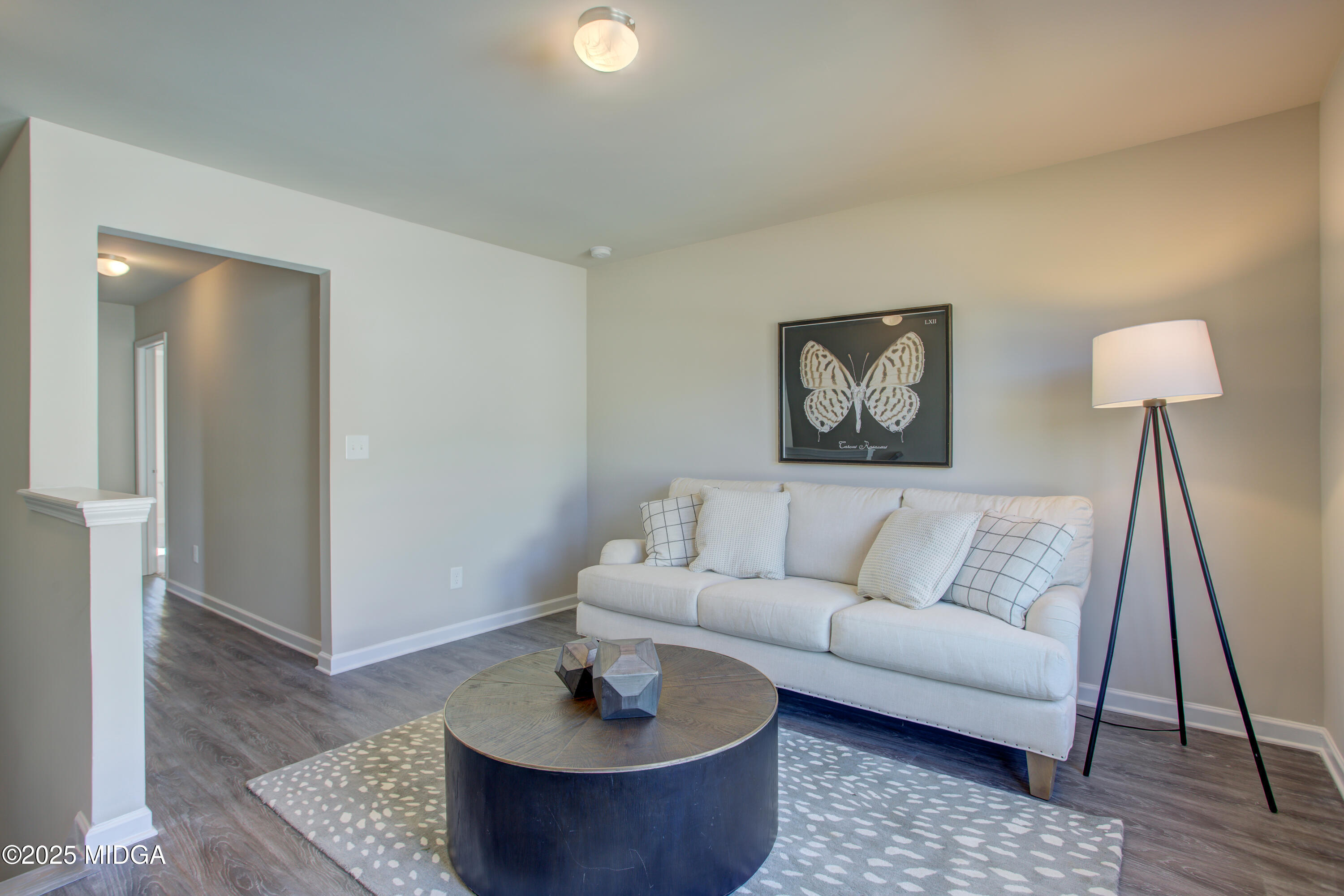 128 Bramblewood Lane Perry, GA 31069 - Photo 21 of 52 a living room with furniture and a wooden floor