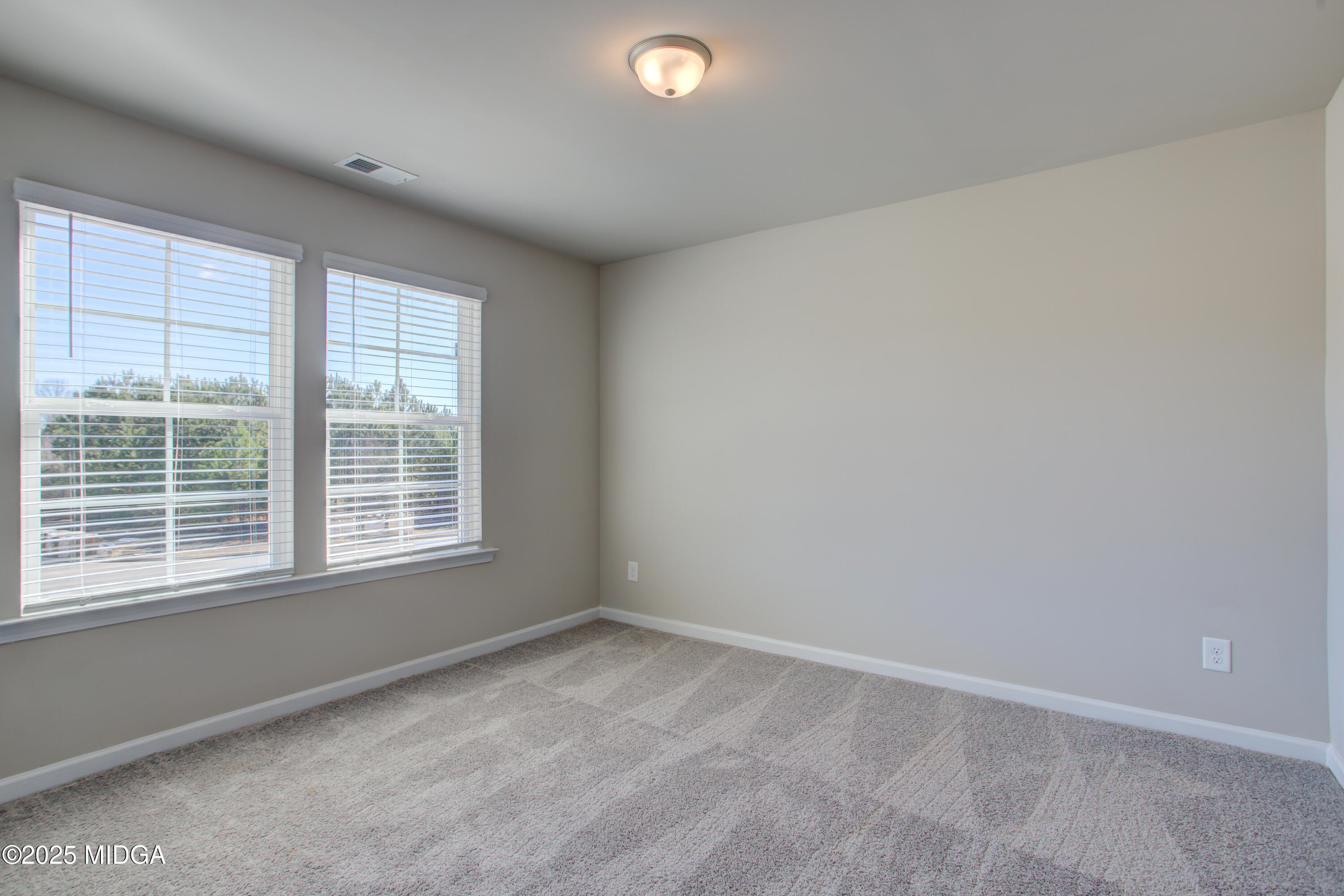128 Bramblewood Lane Perry, GA 31069 - Photo 32 of 52 an empty room with a window