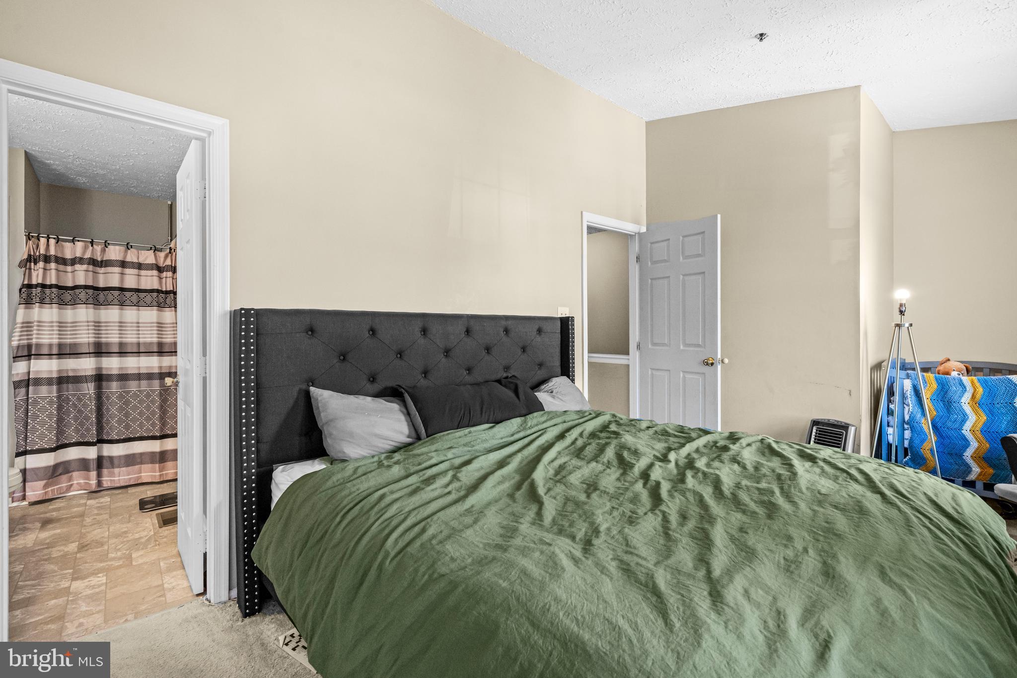 5818 Springfish Place Waldorf, MD 20603 - Photo 16 of 31 a bedroom with a bed and wooden floor