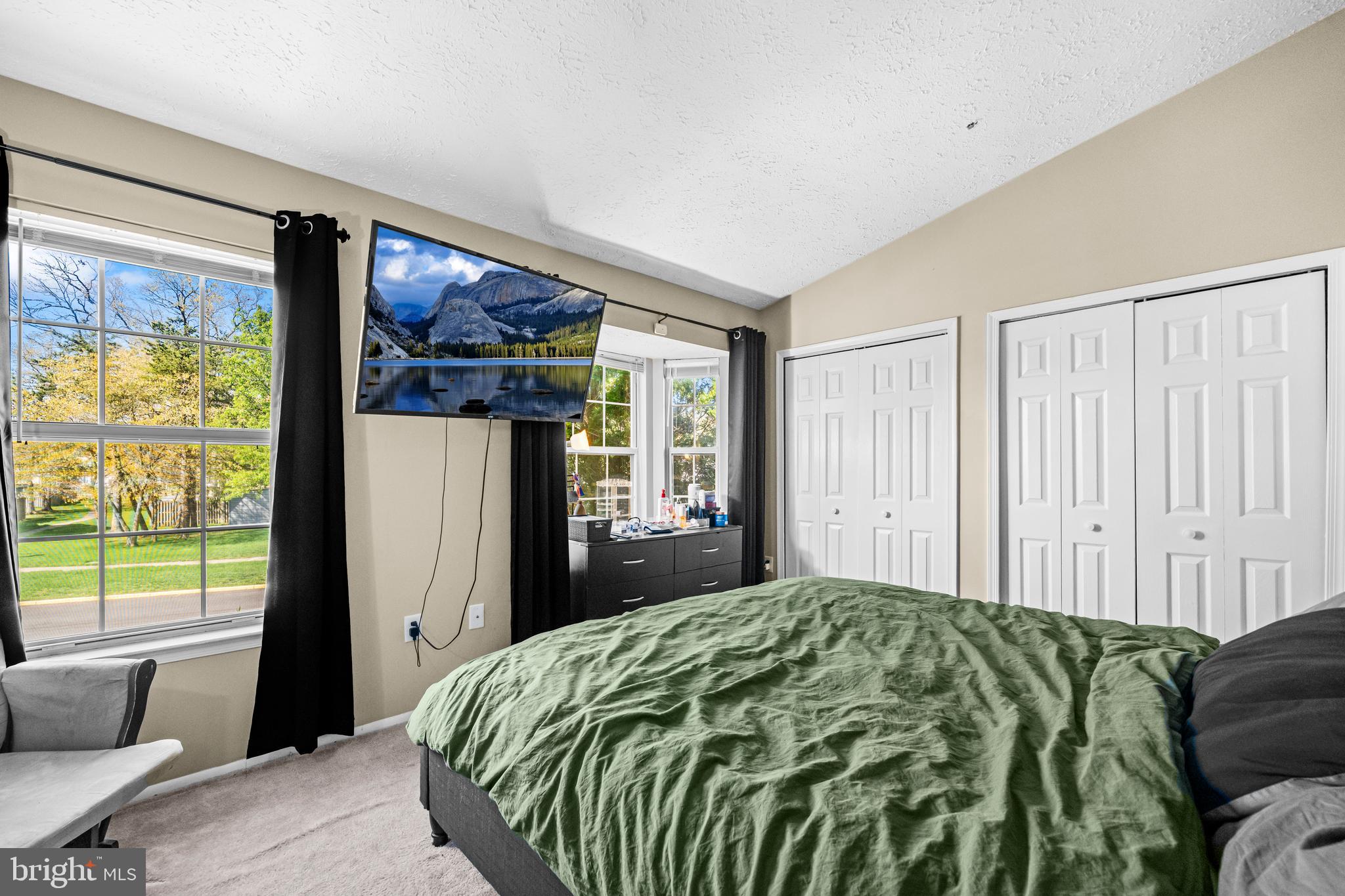 5818 Springfish Place Waldorf, MD 20603 - Photo 17 of 31 a bed sitting in a bedroom next to a window