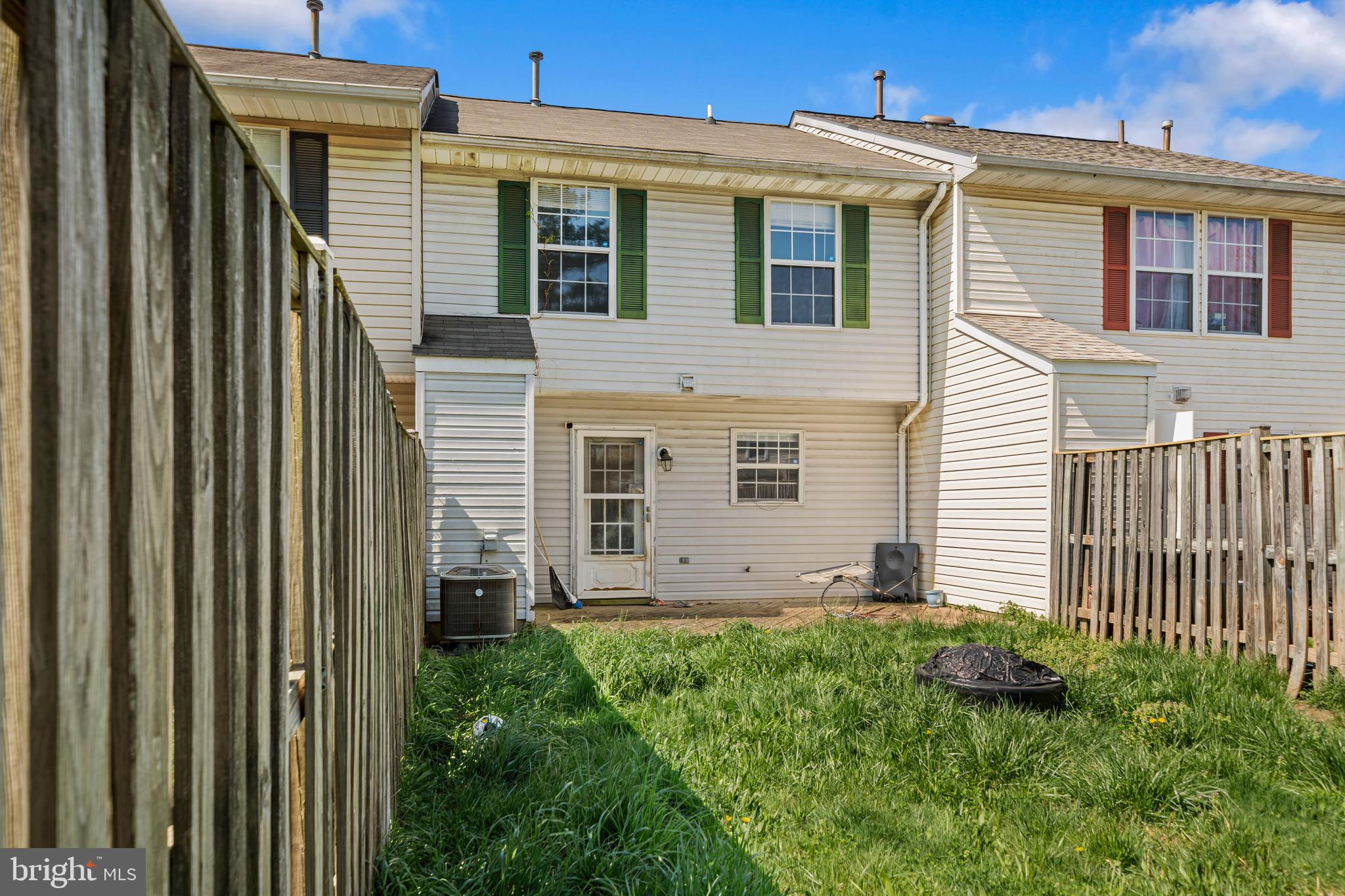 5818 Springfish Place Waldorf, MD 20603 - Photo 26 of 31 a view of a house with a small yard and a large window
