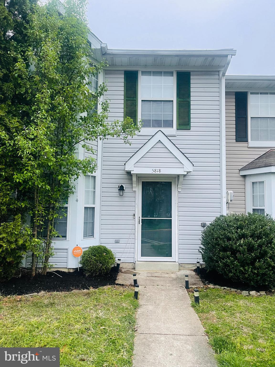 5818 Springfish Place Waldorf, MD 20603 - Photo 3 of 31 a front view of a house with garden