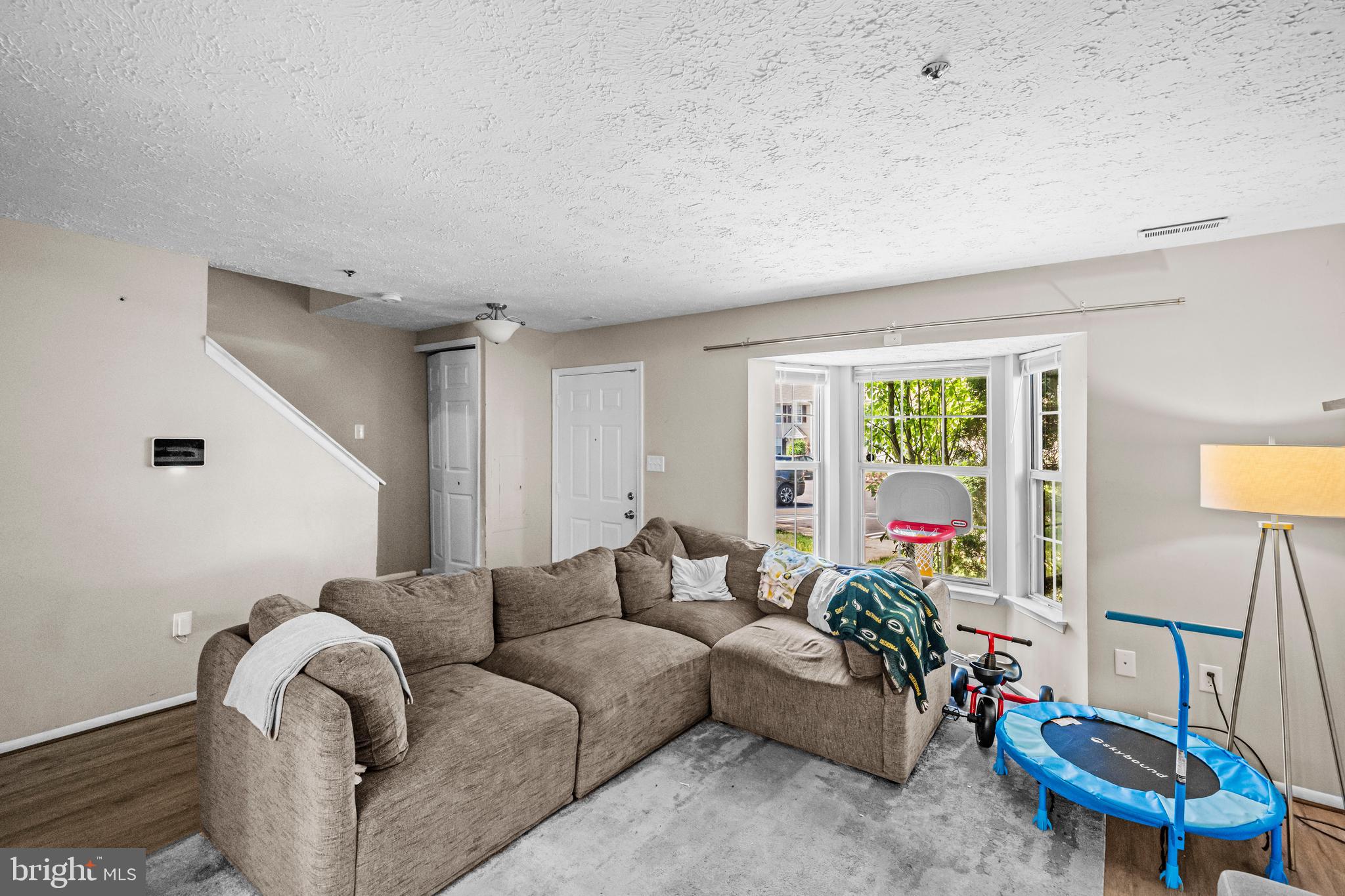 5818 Springfish Place Waldorf, MD 20603 - Photo 5 of 31 a living room with furniture and a large window